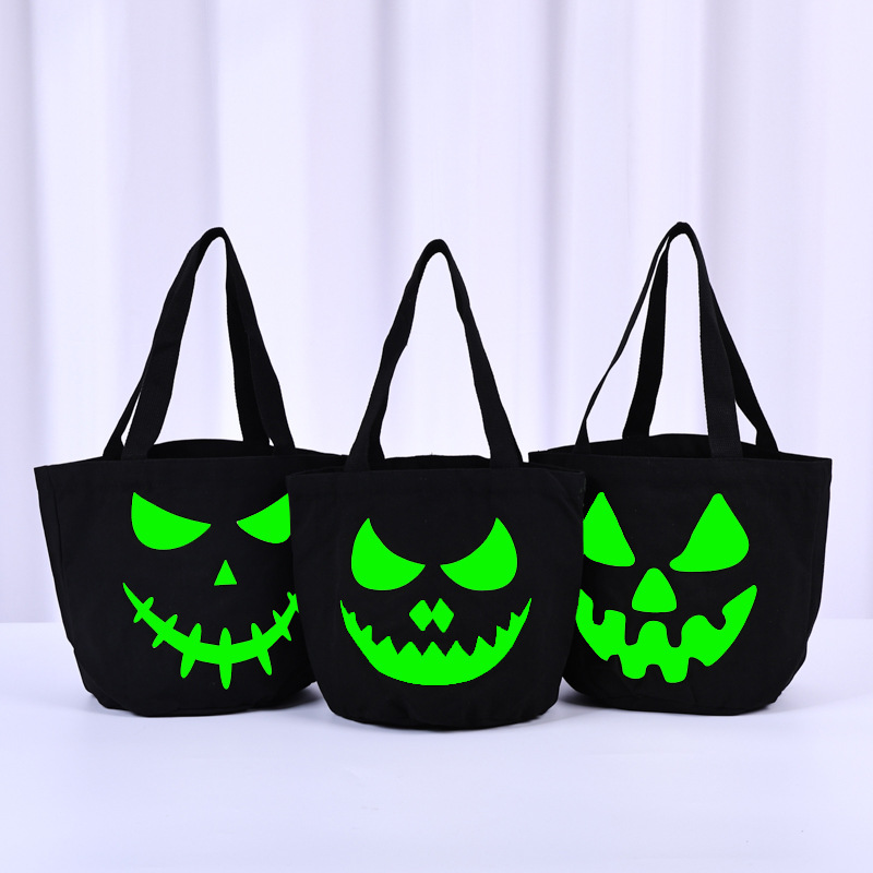 跨境亚马逊万圣节夜光桶装帆布袋派对用品南瓜荧光搞怪讨糖包装袋