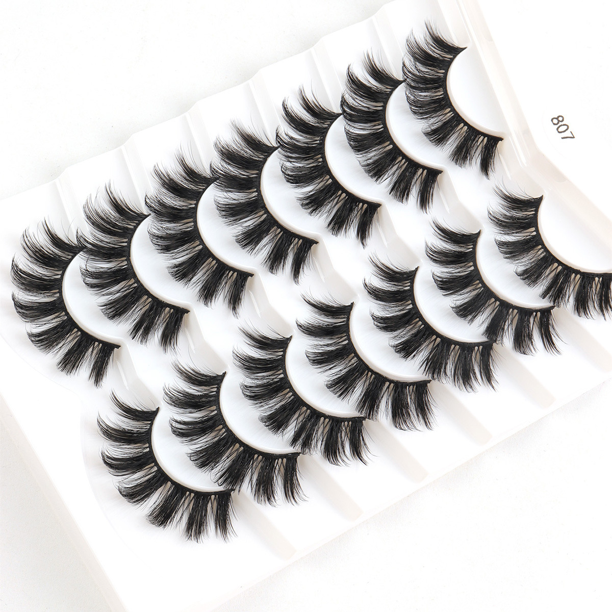 Fábrica al por mayor 7 pares de parillas de visón multicapa densa par de par de pelo desordenado par de parillas falsas cruzadas