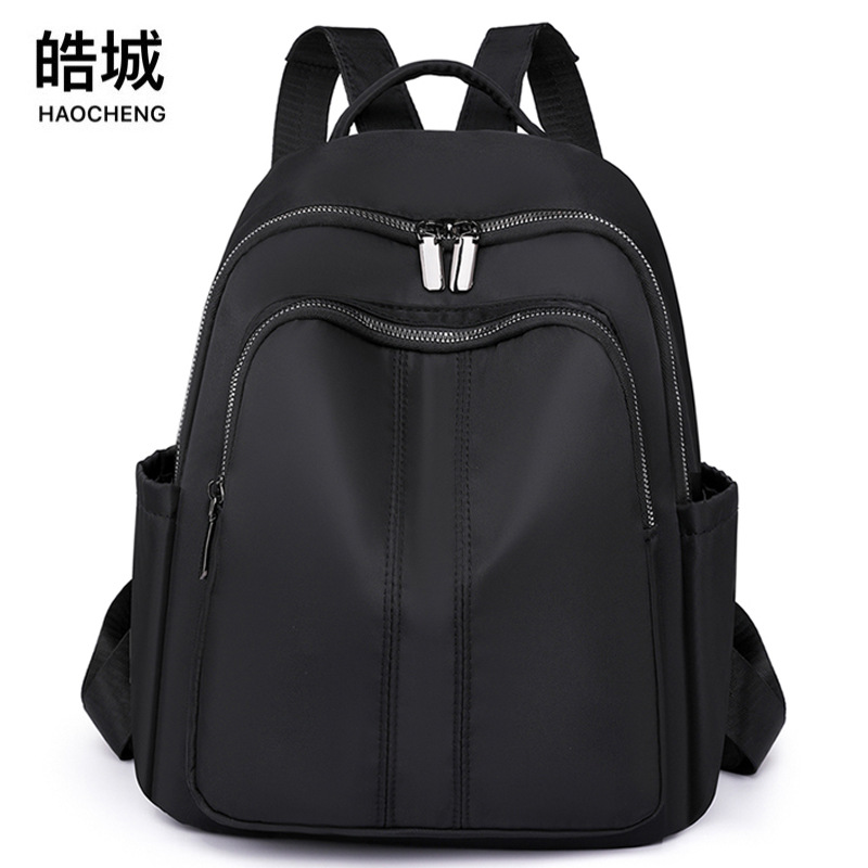 Spot al por mayor 2023 otoño nuevo estilo casual damas mochila de nailon al aire libre mochila de viaje ligera mochila escolar