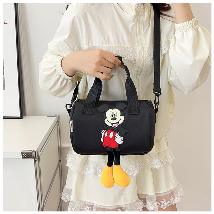 The 2021 new children's bags feature a cute Mickey Mouse pattern bowling bag for girls and a fashionable hand-held shoulder bag undefined