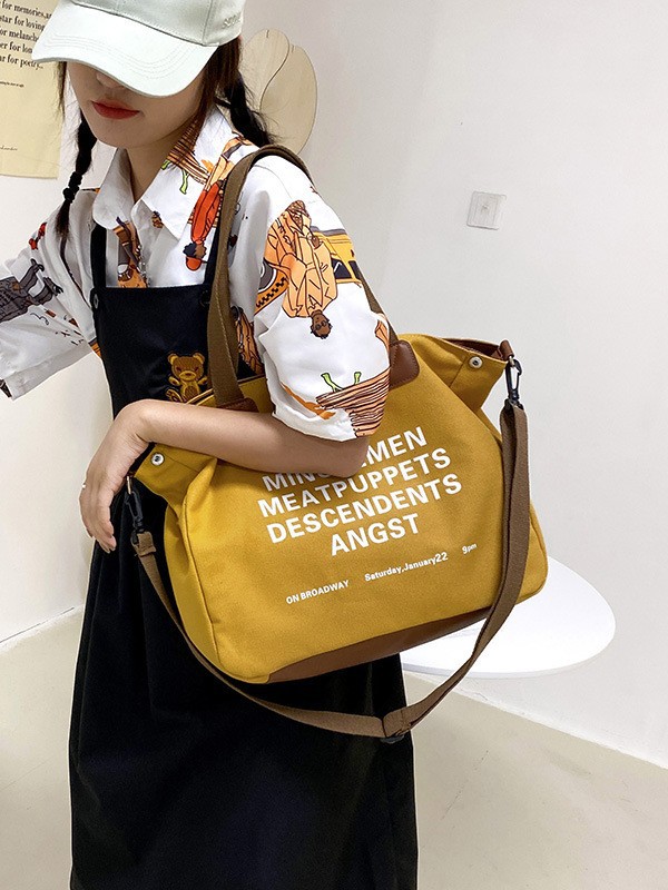 Bolso de lona de alta capacidad, nuevo tipo de bolso de viaje escolar, simple y versátil bolso de hombro.