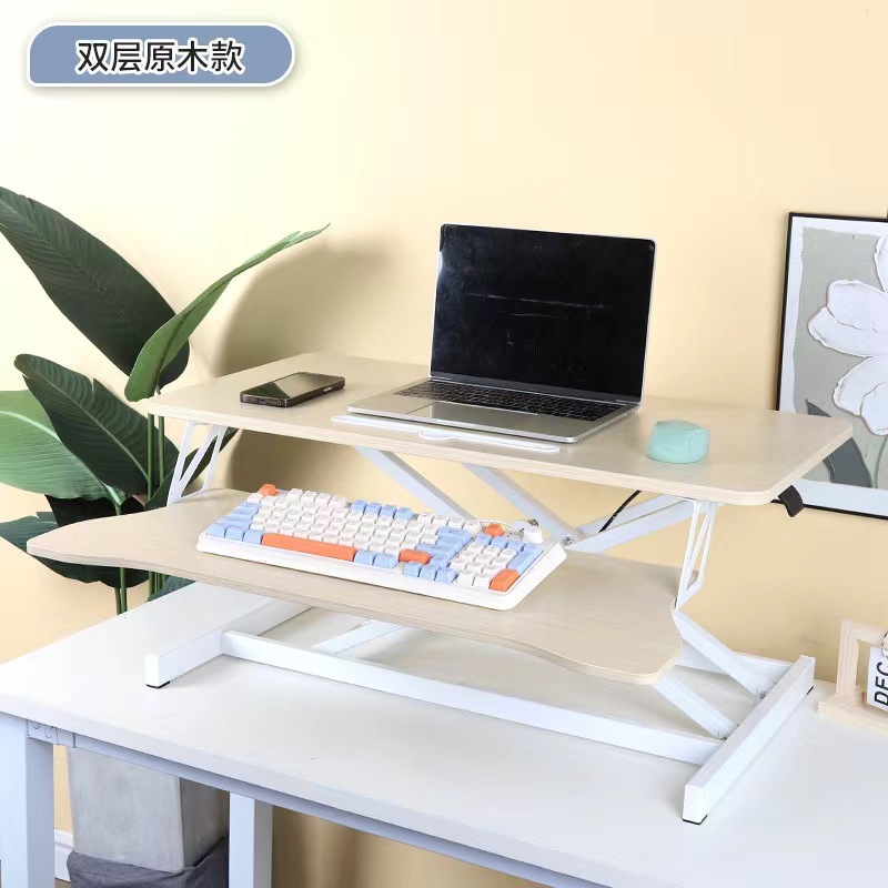 気動机の上のコンピュータの机は立式の事務室の台の上に立って高くなるノートの折り畳みの机で机を昇降することができます。