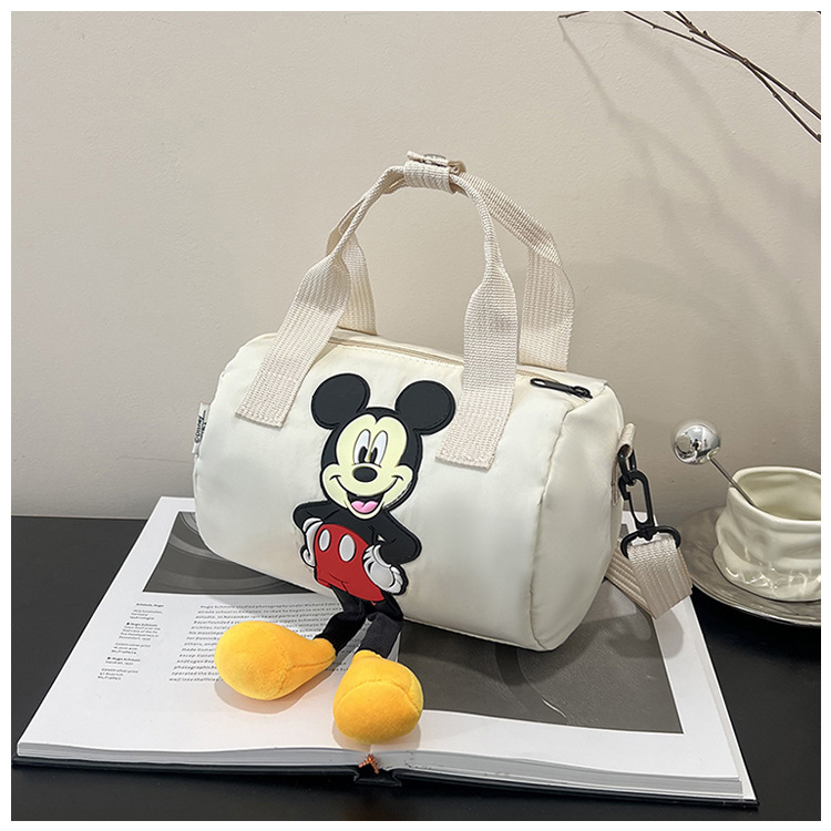 The 2021 new children's bags feature a cute Mickey Mouse pattern bowling bag for girls and a fashionable hand-held shoulder bag undefined