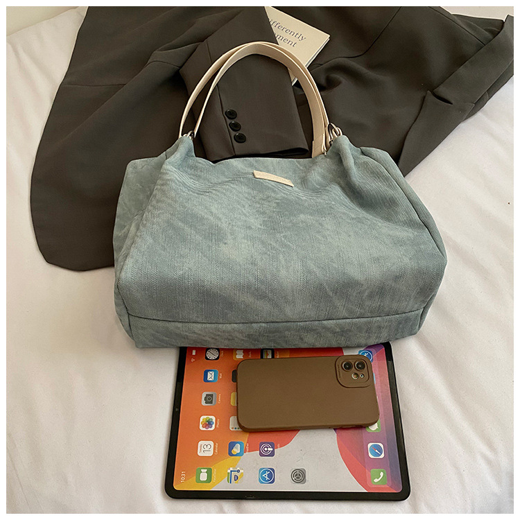 Korean style simple and versatile bag for women, new summer 2025 fashion and niche handbag, large capacity tote bag for commuting undefined