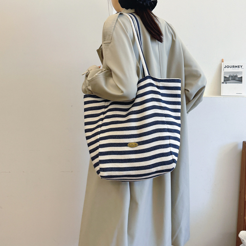 Bolsas de lona a rayas de doble cara nicho de mujeres coreanas de gran capacidad perezosa bolsas de compras de ocio de estudiantes