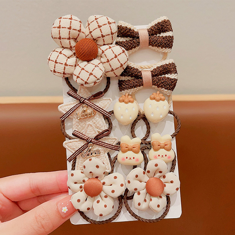 La banda de goma de la flor marrón de la leche de las muchachas de la venda de los niños no lastima el pelo banda elástica alta del pelo de la cola de caballo