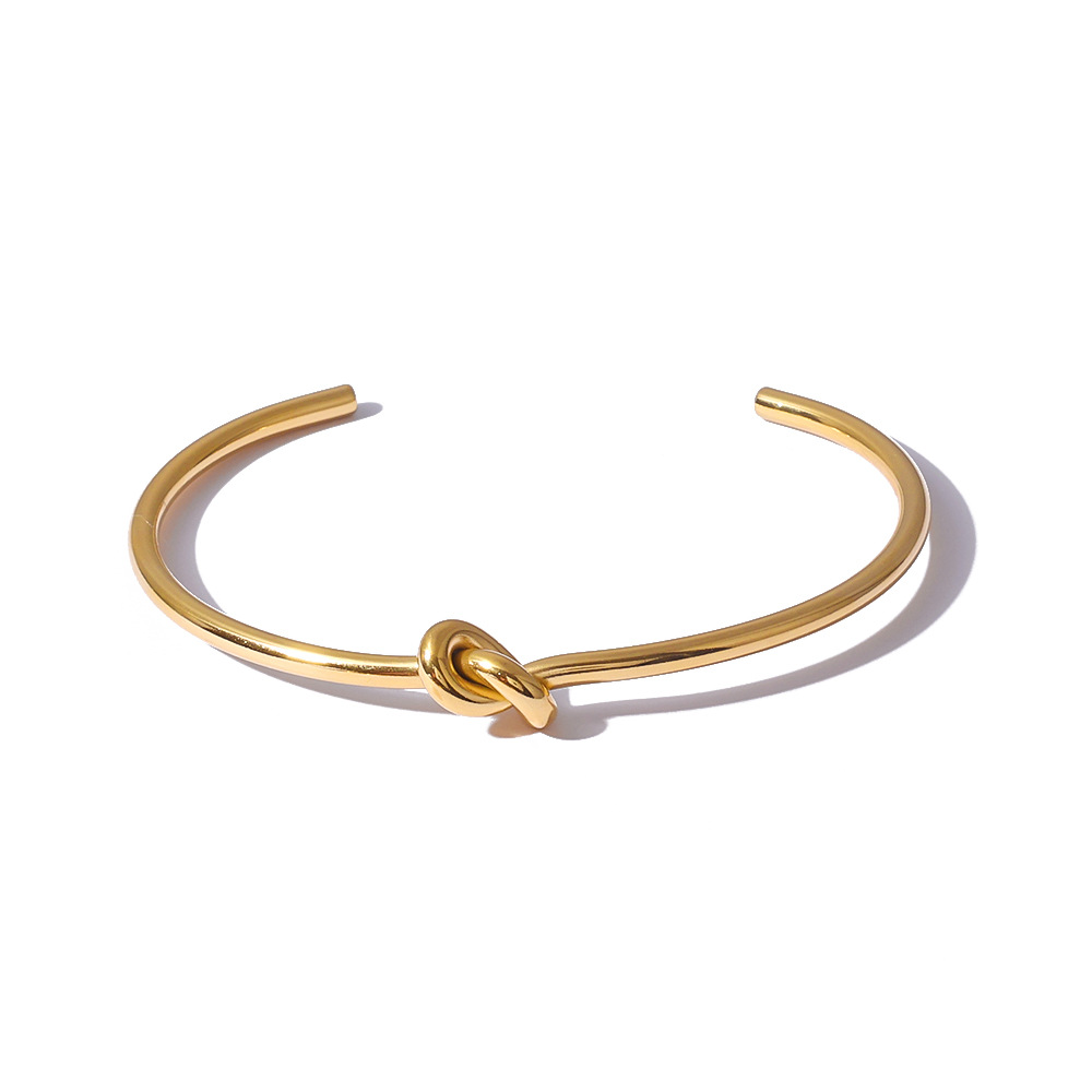 Ins estilo simple personalidad acero inoxidable anudado nudo pulsera abierta pulsera oro real de 18K chapado al por mayor