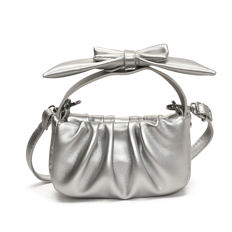 Versión coreana del bolso de nube de niña de color sólido simple estilo occidental pliegue lindo lazo bolso de bebé nuevo bolso para niños