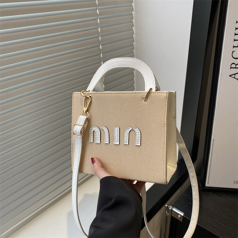 Bolso de mano de moda al por mayor color contraste bolso de mujer 2025 verano nueva letra de lujo bolso de hombro de viaje mochila