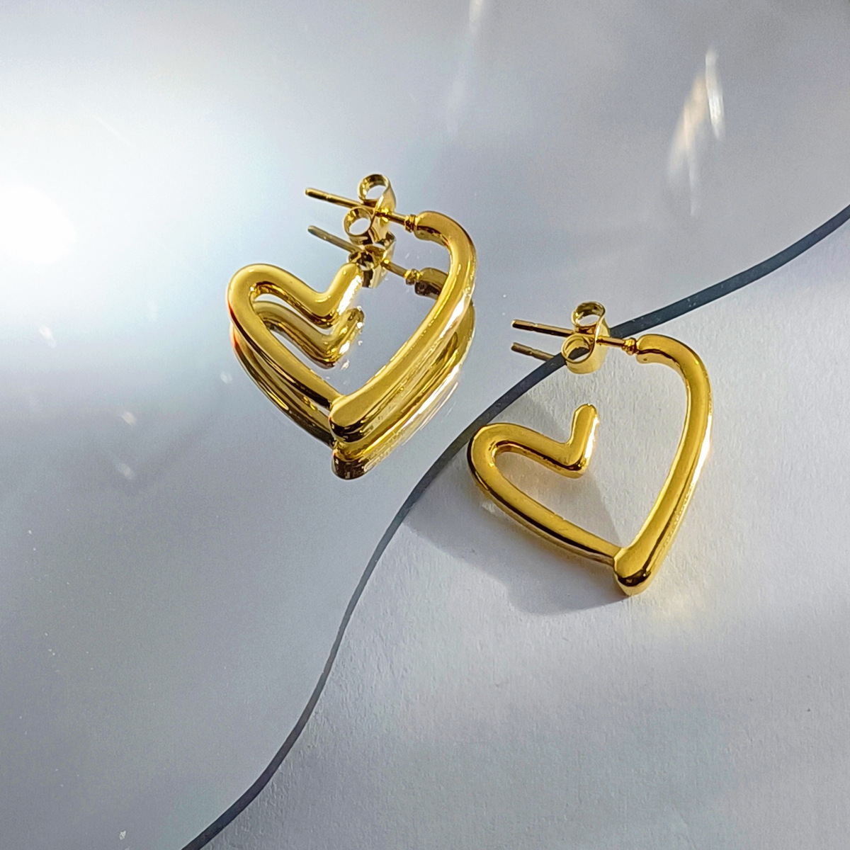 Cross-border best-selling oil-pressure stainless steel hollow earrings from Europe and America, high-end, trendy and light luxury style, 18K earrings wholesale 37 Application Scenario
