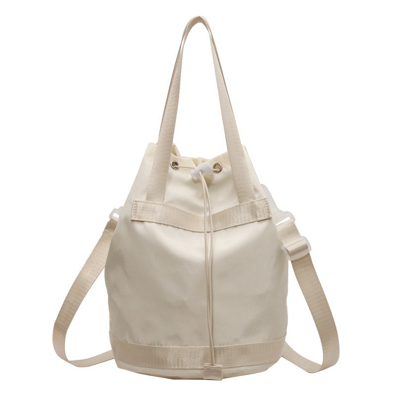 Fabricantes al por mayor 2024 primavera nuevas señoras bolso de cubo de nailon moda todo fósforo ligero bolso diagonal de un solo hombro bolso femenino