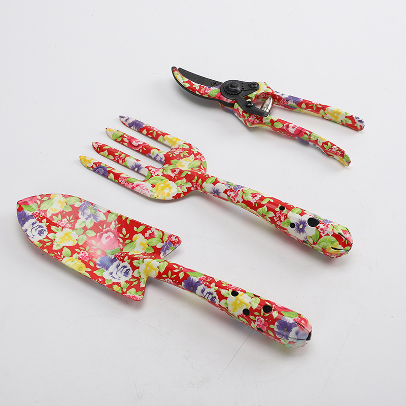 Herramientas al aire libre textura de impresión de flores pequeñas herramientas de jardín conjunto de tres piezas de impresión pala jardín flores y plantas herramientas de jardinería