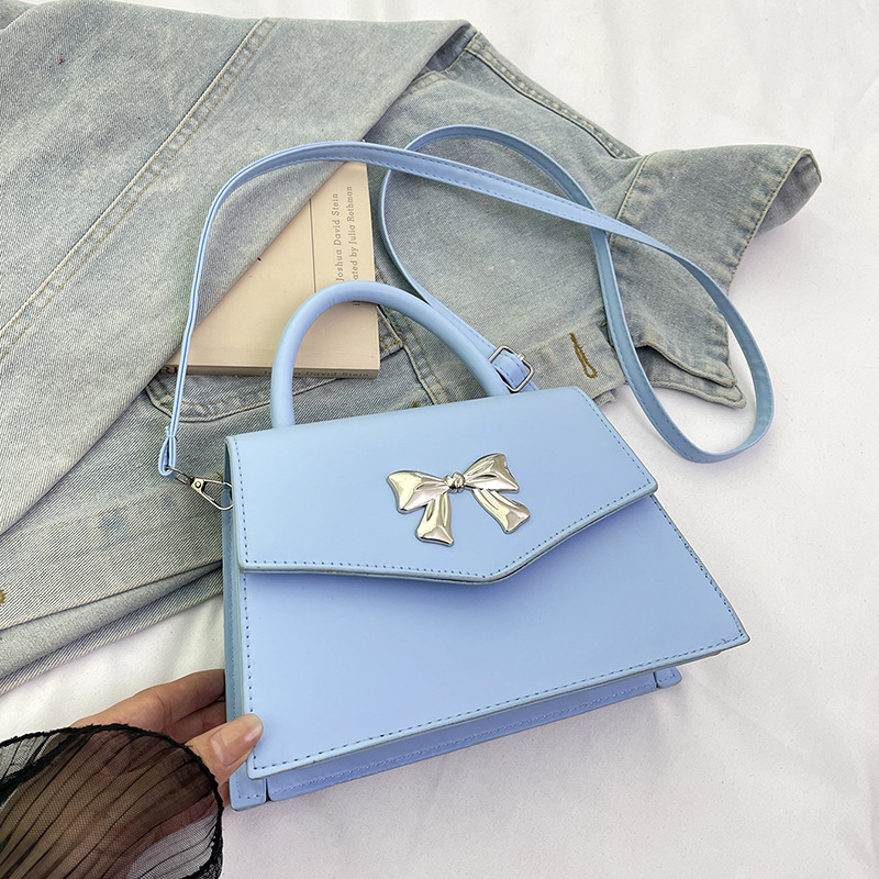 Arco de moda de verano 2025 hermoso nuevo estilo ocio de estilo extranjero suave portátil de hombro mochila pequeña bolsa de mujer