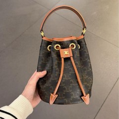 凱旋門の古い花のバケツの包みの女性の2025新型の大容量の縄のハンドバッグのファッションの潮流のシングル肩の斜めのショルダーバッグ