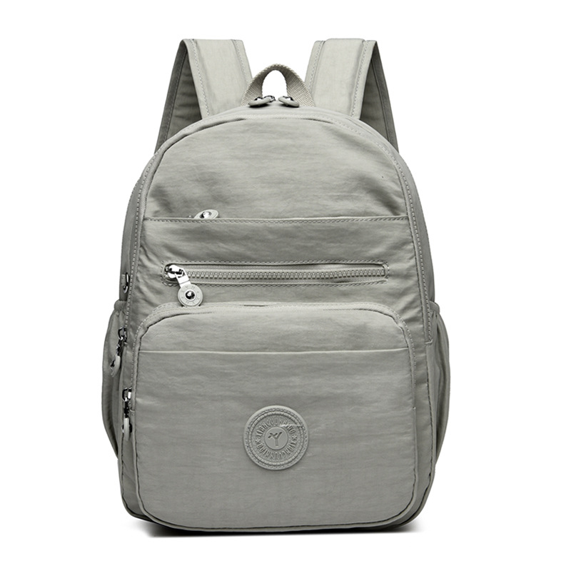 Mochila de hombro de comercio exterior 2025, nueva mochila de computadora simple de color sólido, mochila de escuela secundaria, mochila para hombres y mujeres.