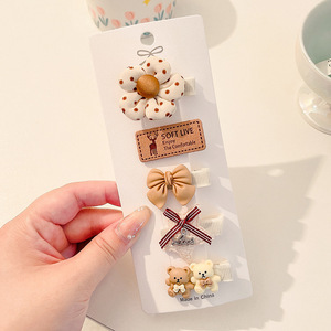 Hermosos clips de cabello de color para niños coreanos de alto nivel sensación de arco de niñas bolsa de tela no daña clips de cabello de bebé