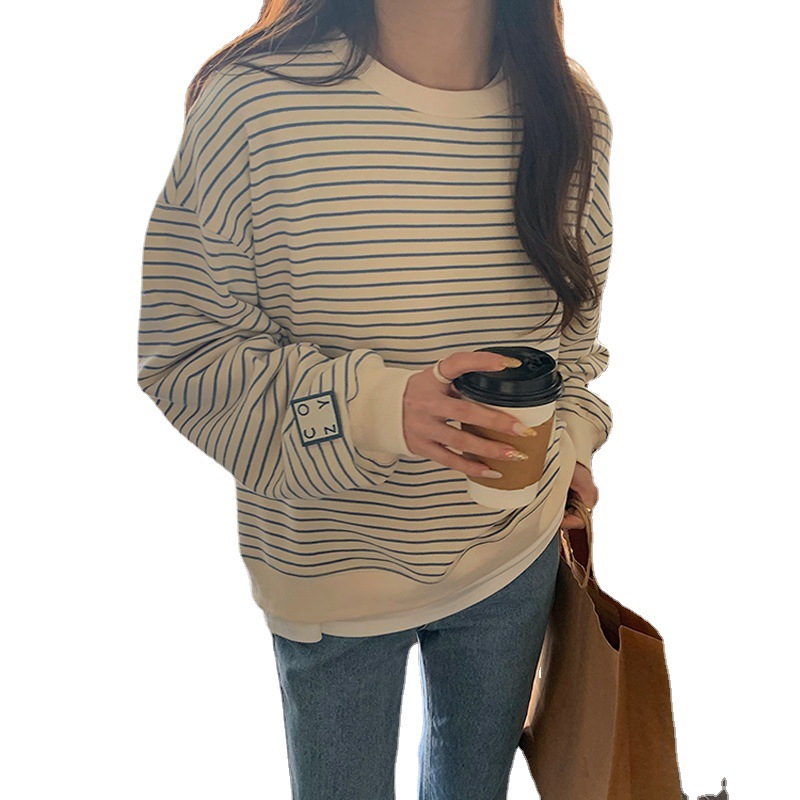 Selección estricta manga fuera del hombro suéter de manga larga a rayas diseño de nicho de las mujeres adelgazamiento Oversize primavera y verano transfronterizo Top Moda