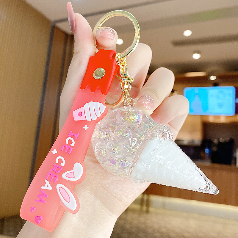 Arenas flotantes transfronterizas coloridas frijoles botellas flotantes de helado llaveras de chicas bolsos colgantes de arena flotante pequeña decoración colgante para mujeres