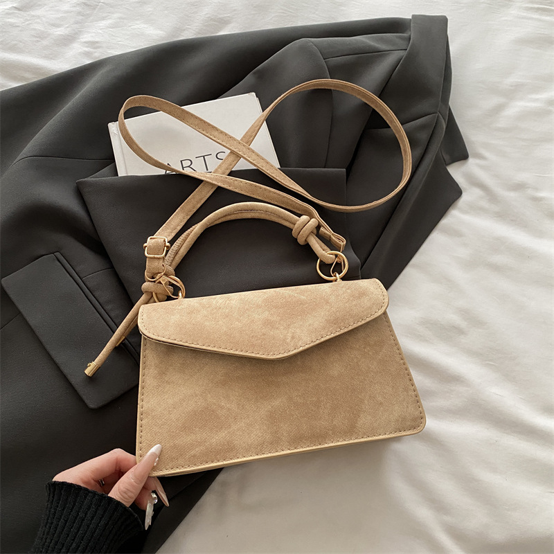 Bolso público pequeño para mujeres 2026 nuevo bolso cuadrado de alta calidad sensación de diseño retro bolso de hombro simple bolso de mano
