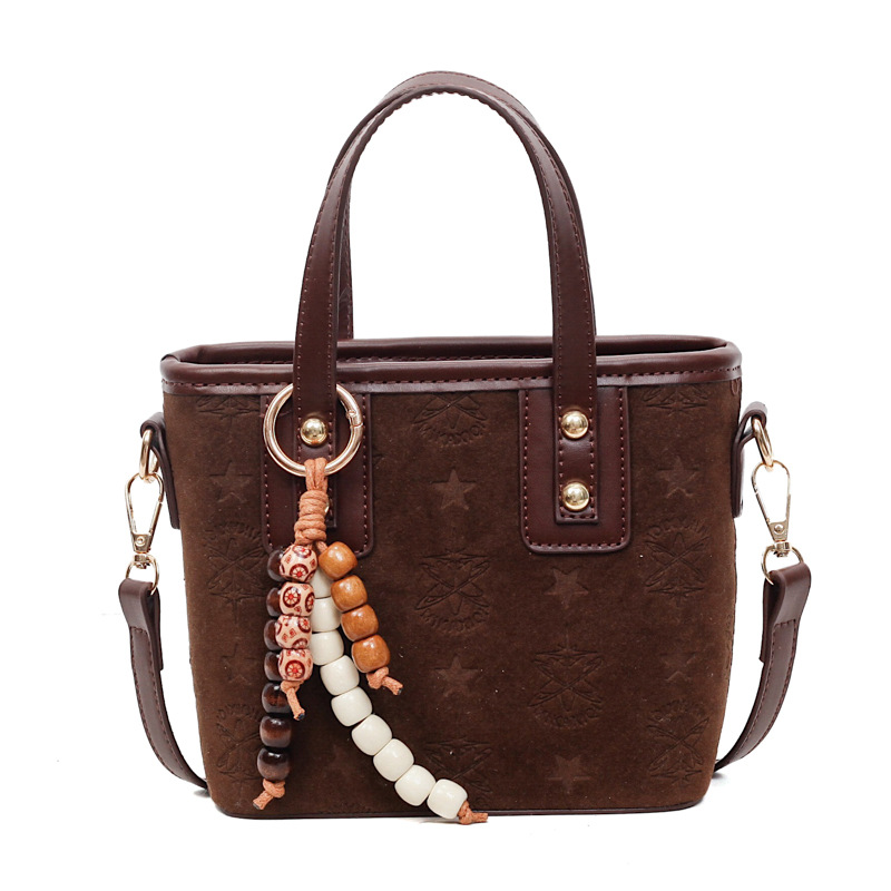 Popularidad transfronteriza retro bolso de cubo portátil para mujeres otoño / invierno 2025 nueva moda versátil bolso de hombro simple mochila