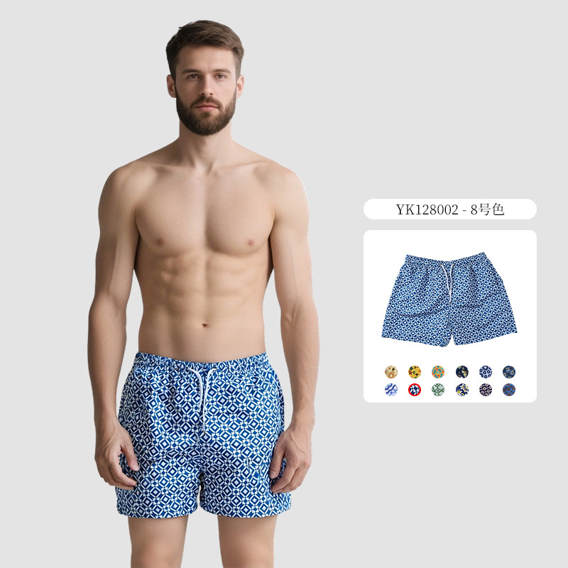 Pantalones de cuatro puntos florales de piel de melocotón para hombre, bañador casual de playa de tamaño europeo, forro de secado rápido, pantalones de playa de vacaciones junto al mar
