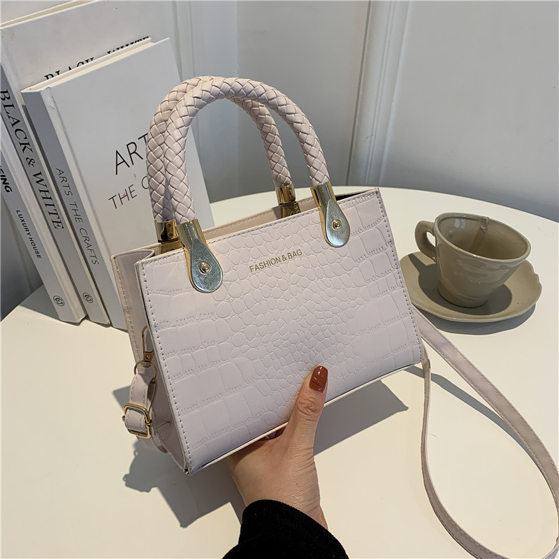 Bolsa de moda con textura para mujer 2024 estilo coreano estilo occidental nuevo color caramelo patrón de piedra bolso tejido bolsa de mensajero