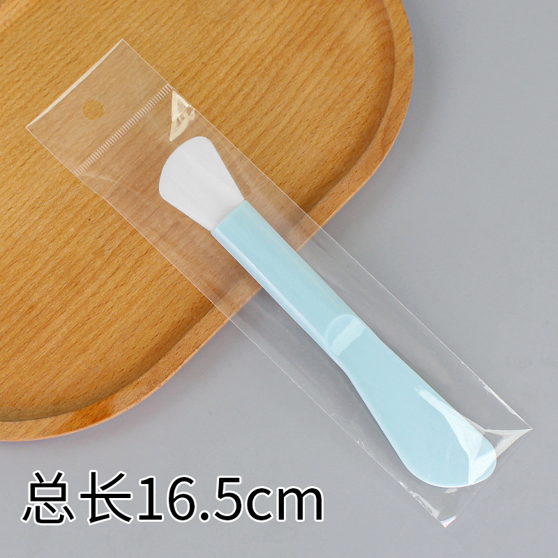 Large double-headed long-handled brush, blade-shaped, lake blue.