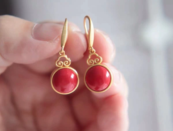 Red protective amulet, buckle, earrings