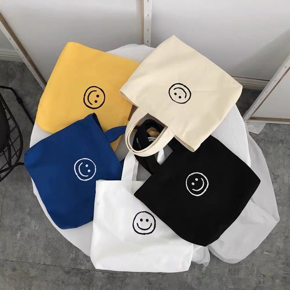 Canvas bag ins simple smiling face series girls fresh student advertising small hand collar bag accompanying gift custom logo