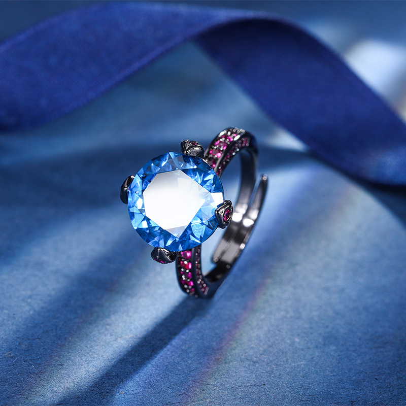 2024 Nueva Zhuang Sheng joyería de cobre de fondo chapado en oro de simulación corindón redondo anillo de personalidad de Oro Negro femenino 12mm