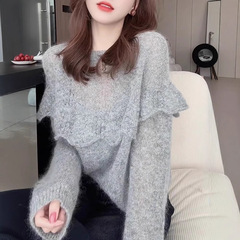 春の服装は鉤花の透かし彫りのセーターを着ています。