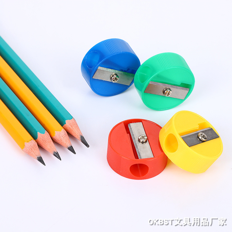 Fábrica de sacapuntas redondos geométricos Sacapuntas de lápiz redondo resistente al desgaste creativo de plástico papelería de aprendizaje