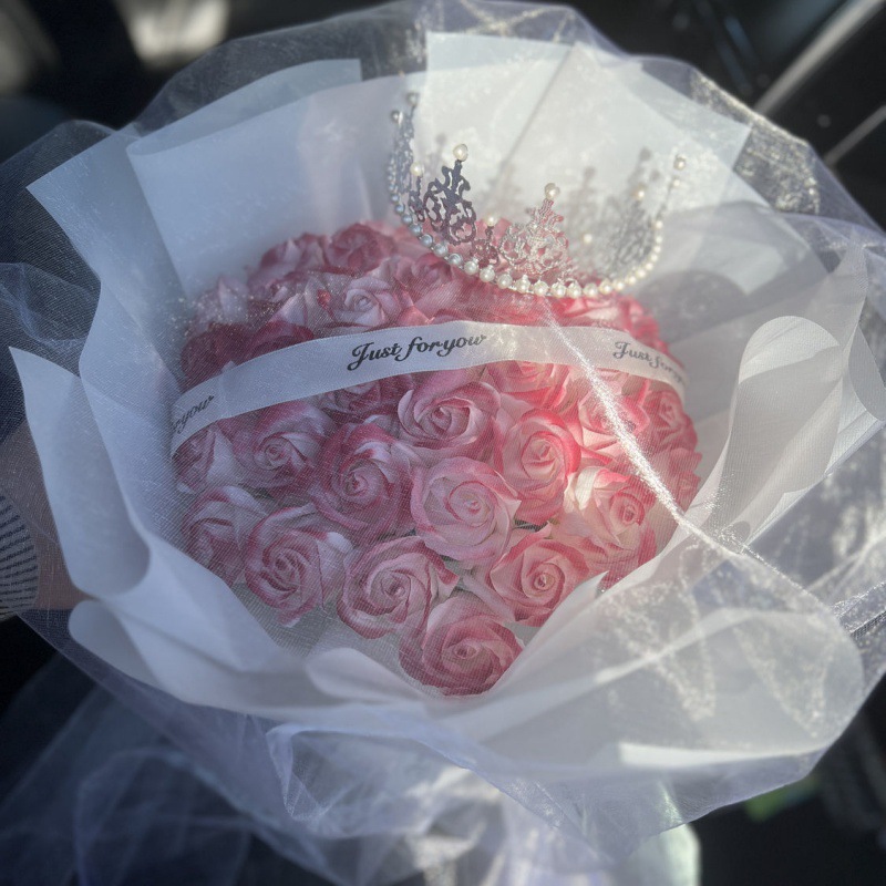 A bouquet of crushed ice blue roses, baby's breath, everlasting flowers, and dried flowers as a gift for a girlfriend, best friend, birthday, or Christmas.