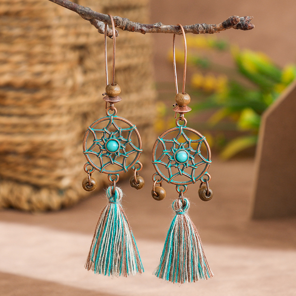 New vintage leaf pendant earrings women's fashion hollow carved alloy tassel earrings European and American fashion jewelry batch