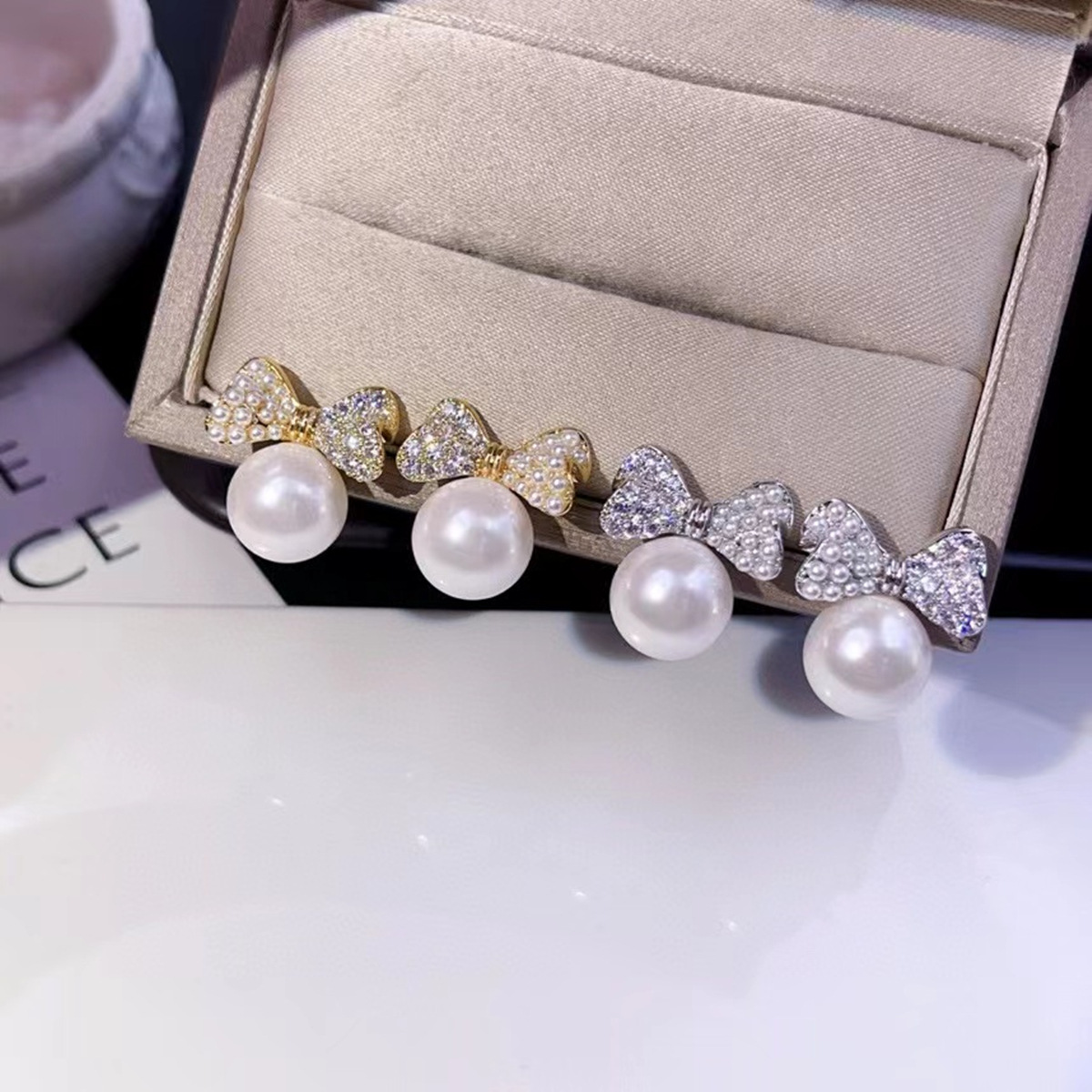 Korean fashionable elegant earrings with bow pearl with zircon