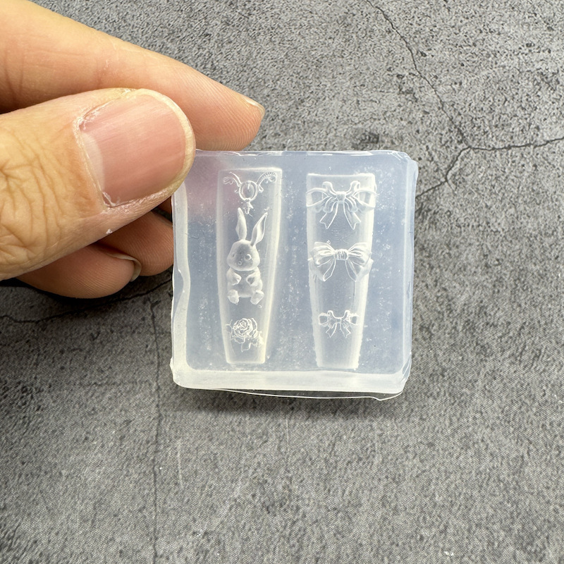 氷感の高い爪の金型のチューリップの漫画の蝶結びのシリコンの膜は爪のツールセットの工場の卸売りを備えます。|undefined