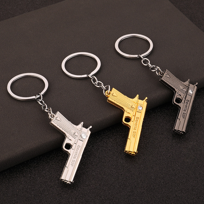 Wholesale cross-border mini metal pistol men's car pendant Jesus survival peripheral simulation model gun keychain Wholesale cross-border mini metal pistol men's car pendant Jesus survival peripheral simulation model gun keychain