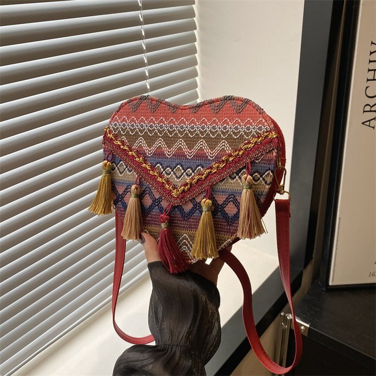 Mayorista bolsos de estilo nacional de mujer 2024 moda nueva mochila en forma de corazón bolsos de hombro bohemios transfronterizos