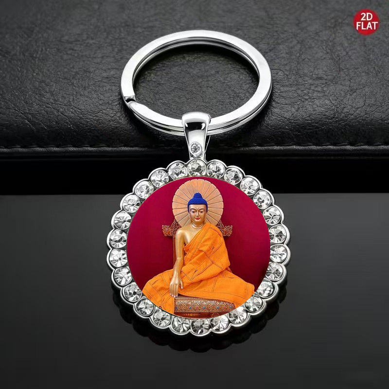 Red background with orange clothing Shakyamuni Buddha keychain with diamond-encrusted time gemstone, backlit Buddha round glass pendant Red background with orange clothing Shakyamuni Buddha keychain with diamond-encrusted time gemstone, backlit Buddha round glass pendant