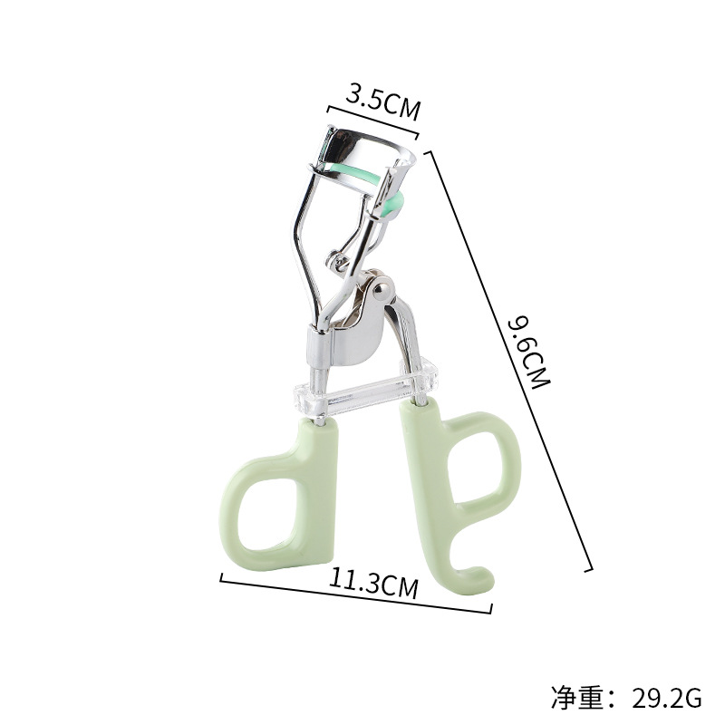 버클이 달린 밝은 녹색 가위 손잡이