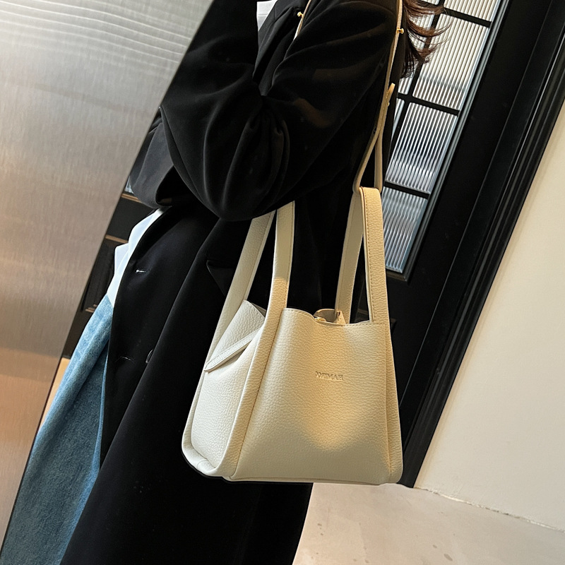 Bolsos de moda de nicho retro para mujer 2025 verano nuevo bolso de mensajero bolso de cubo de moda de alta gama bolso de hombro