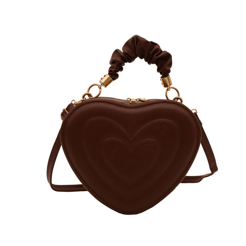 2024 otoño y invierno de mujeres nuevas caramelo de cáscara dura bolso de hombro de color corazón bolso de moda bolso de amor amor amor impresión