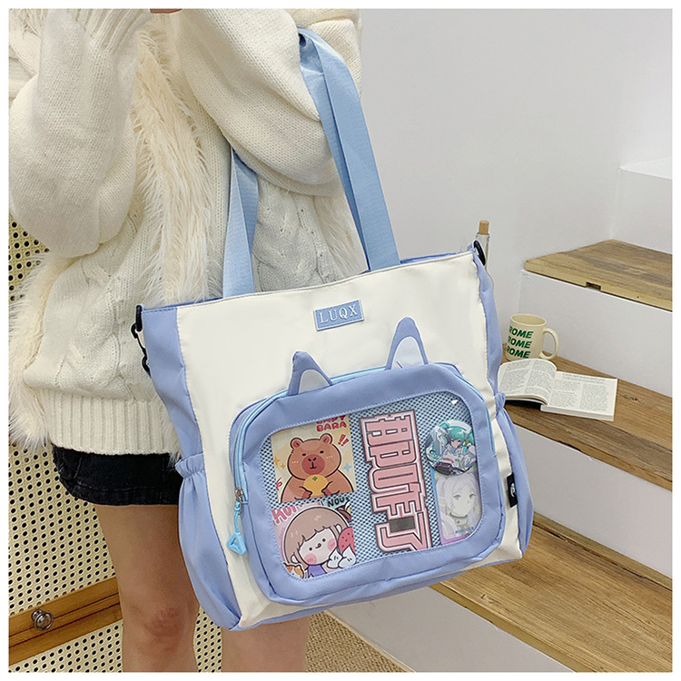 The new cute cartoon printed student bag with a large capacity and transparent student storage single-shoulder bag is selling well for women undefined