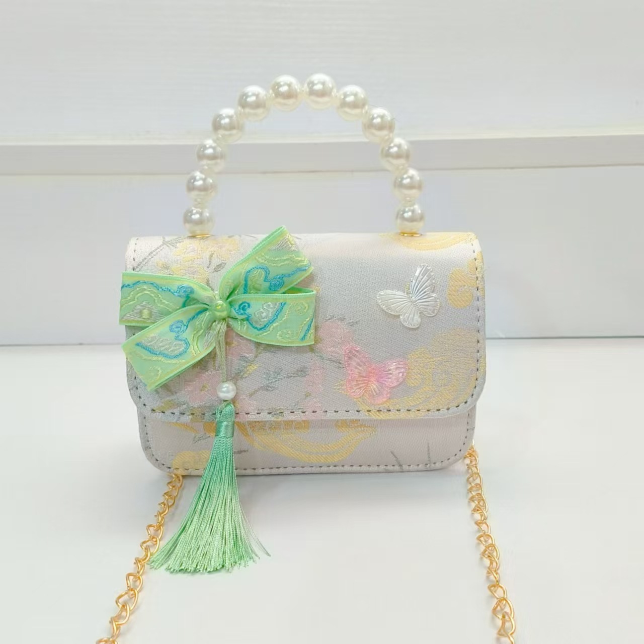 Bolsa de arco de estilo nacional de la princesa bolso de perla bolso de cadena bolso cuadrado bolso accesorios de ropa china para niños regalos de vacaciones de niñas