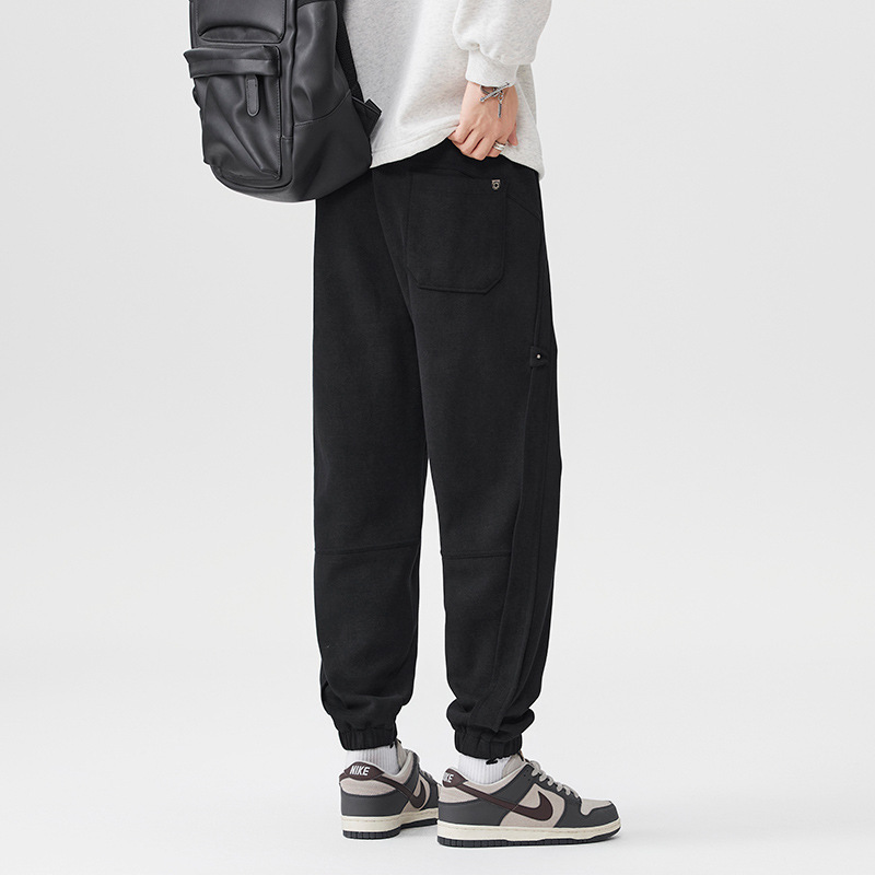 2025 otoño y invierno nuevos pantalones negros para hombres sueltos pantalones deportivos casuales de cintura elástica de tamaño grande con etiquetas colgantes image 2