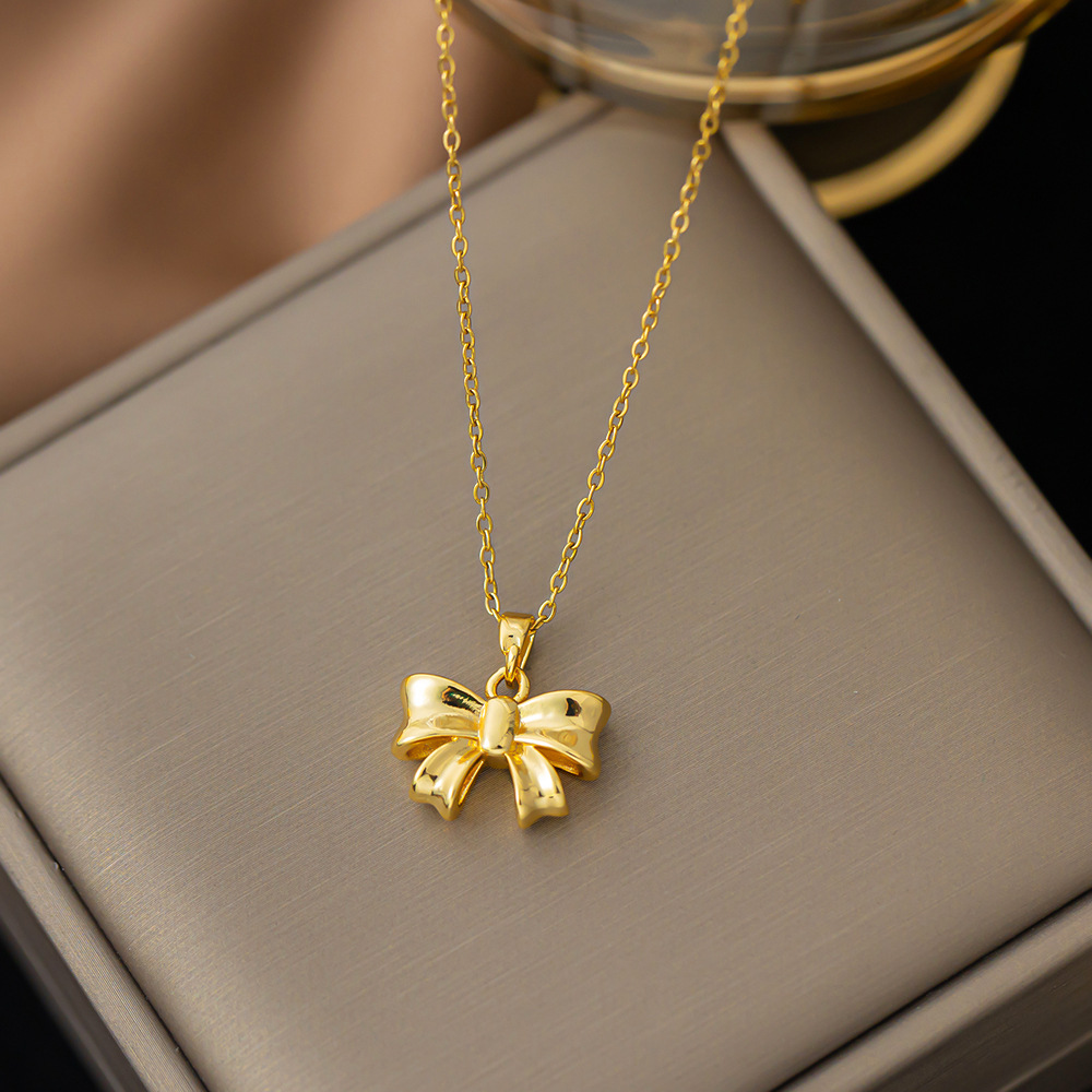 Titanium Steel Copper Gold Plated Simple Style Bow Knot Pendant Necklace display picture 5