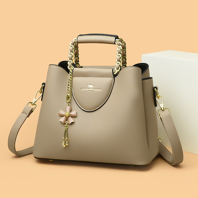 Nueva moda de hombro de las mujeres costura pequeño tamaño exquisito cubo bolsa de gran capacidad de cuero suave de una sola pieza de entrega para mamá más joven