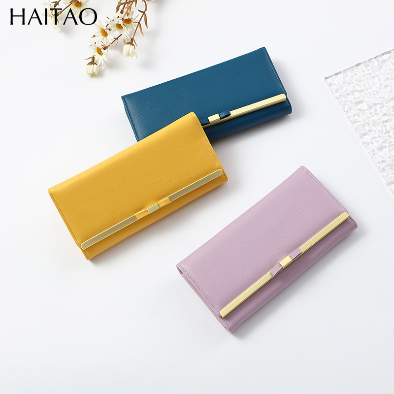 Nueva cartera larga para mujer, bolso de mano tipo clutch de color sólido de alta gama, cartera de cuero genuino al por mayor.