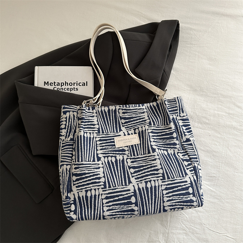 Bolso a rayas casual de todos los partidos de nicho para mujer 2024 nuevo bolso de hombro de gran capacidad de moda retro bolso de viaje