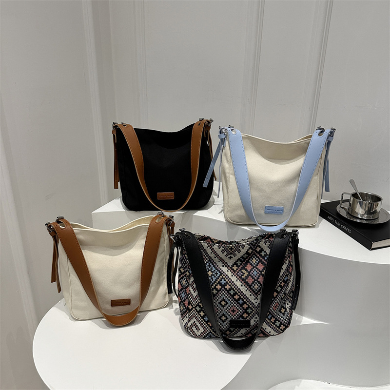 Bolso bandolera de lona de moda para mujer 2024 marea de otoño nuevo estilo de gran capacidad de costura de color de contraste viaje a clase bolso de viaje